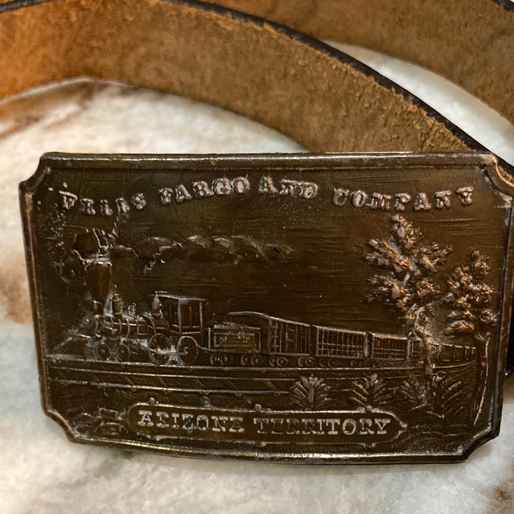 Brass buckle belt.  44”